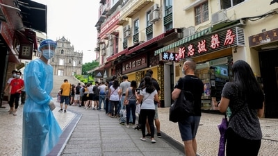 FILE PHOTO: People queue for the mass coronavirus disease (COVID-19) testing near the Ruins of Saint Paul's in Macau, China June 20, 2022.&nbsp; (REUTERS)