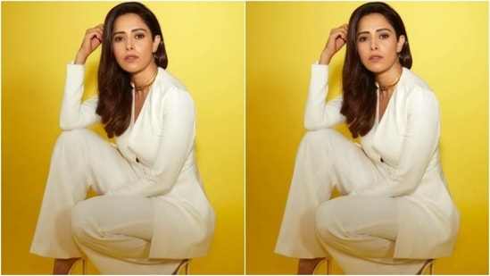 Nushrratt decked up in a white blazer with a plunging neckline and full sleeves. The white blazer featured buttons in the middle and hugged Nushrratt’s shape perfectly.(Instagram/@nushrrattbharuccha)