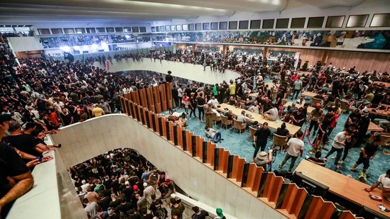 Supporters of cleric Moqtada Sadr, protesting against a rival bloc's nomination for prime minister, gather inside Iraq's parliament in the capital Baghdad's high-security Green Zone.(AFP) Supporters of cleric Moqtada Sadr, protesting against a rival bloc's nomination for prime minister, gather inside Iraq's parliament in the capital Baghdad's high-security Green Zone.(AFP)
