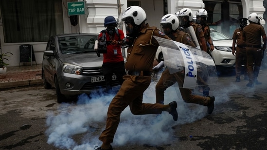 Police officers try to disperse demonstrators using tear gas during a protest outside the Sri Lanka's police headquarters, amid the country's economic crisis.(REUTERS file image)