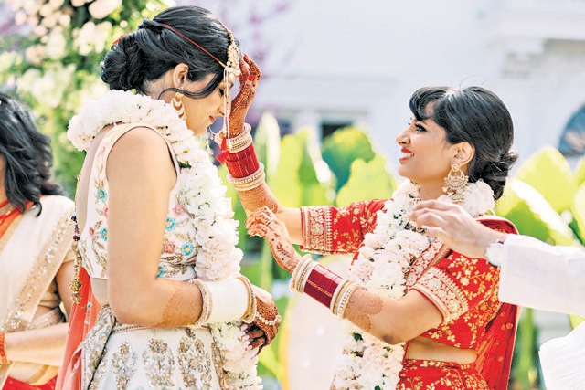 “We wanted to have a big shaadi so LGBTQ people around the world could see that just because you’re Indian and queer doesn’t mean you can’t have a happy future,” says Deepa Kollipara, seen her marrying her partner Gauri Joshi (left). (Apollo Fotografie) “We wanted to have a big shaadi so LGBTQ people around the world could see that just because you’re Indian and queer doesn’t mean you can’t have a happy future,” says Deepa Kollipara, seen her marrying her partner Gauri Joshi (left). (Apollo Fotografie)