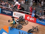 General view of a crash in the Men's 15km scratch race qualifying round as England's Matt Walls (top left) and Canada's Derek Gee (right) go over the barrier into the crowd at Lee Valley VeloPark at the 2022 Commonwealth Games.(AP)