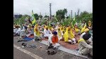 Farmers under the banner of Sanyukt Kisan Morcha (SKM) protesting against the Union government on the Ludhiana-Ferozepur Highway on Sunday. (HT Photo)