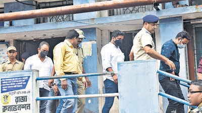 West Bengal police personnel arrested three Jharkhand Congress MLAs after a huge amount of cash was found in their vehicle on Saturday, in Howrah district on Sunday. (PTI) West Bengal police personnel arrested three Jharkhand Congress MLAs after a huge amount of cash was found in their vehicle on Saturday, in Howrah district on Sunday. (PTI)