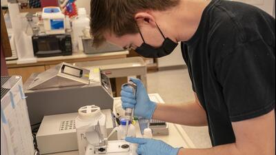 A lab worker measures the concentration of proteins while working on vaccine and protein research in the Veesler Lab at the University of Washington in Seattle, Washington (For representational purpose only). (AFP)