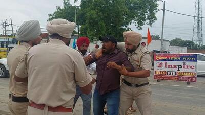Sangrur police detaining a protesting physical training instructor in Sunam on Sunday. (HT Photo) Sangrur police detaining a protesting physical training instructor in Sunam on Sunday. (HT Photo)
