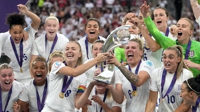England's Leah Williamson, center left, and Millie Bright lift the trophy after winning the Women's Euro 2022 final soccer match (AP) England's Leah Williamson, center left, and Millie Bright lift the trophy after winning the Women's Euro 2022 final soccer match (AP)