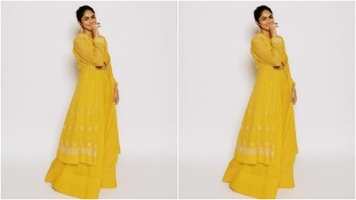 Mrunal teamed it with a pair of bright yellow sharara pants and layered her look with a yellow shrug that came with white thread details in minimal patterns. (Instagram/@mrunalthakur)