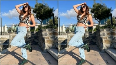 She teamed her cropped top with a pair of blue denims as she posed in tinted shades. (Instagram/@rubinadilaik)