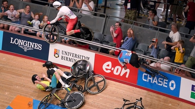 General view of a crash in the Men's 15km scratch race qualifying round as England's Matt Walls (top left) and Canada's Derek Gee (right) go over the barrier into the crowd at Lee Valley VeloPark at the 2022 Commonwealth Games. (AP) General view of a crash in the Men's 15km scratch race qualifying round as England's Matt Walls (top left) and Canada's Derek Gee (right) go over the barrier into the crowd at Lee Valley VeloPark at the 2022 Commonwealth Games. (AP)