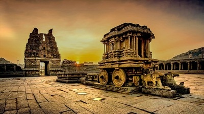 Hampi was the capital of the Vijayanagar Empire around 1500 AD, and by some accounts, the second largest city in the world at that time. Over the centuries it may have fallen out of importance, and now there lie ruins of a lot of temples and other structures spread out over a vast area. (Karnataka tourism)