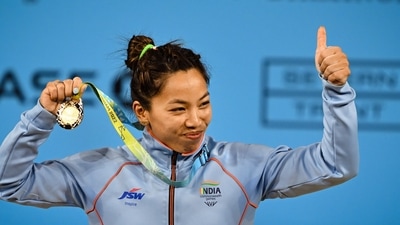 Birmingham: India's Mirabai Chanu with the gold medal after winning women's 49kg weightlifting category match of the Commonwealth Games 2022 (CWG), in Birmingham, UK, Saturday, July 30, 2022. (PTI Photo/Swapan Mahapatra)(PTI07_30_2022_000336B) (PTI)
