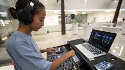Saudi DJ Leen Naif plays at a university event in Saudia Arabia's Red Sea coastal city of Jeddah on May 26, 2022. (AFP) Saudi DJ Leen Naif plays at a university event in Saudia Arabia's Red Sea coastal city of Jeddah on May 26, 2022. (AFP)