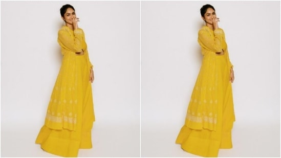 Mrunal teamed it with a pair of bright yellow sharara pants and layered her look with a yellow shrug that came with white thread details in minimal patterns.(Instagram/@mrunalthakur)