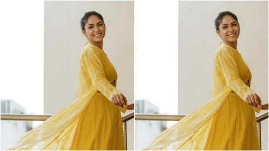 Styled by hairstylist Deepali Dilip Deokar, Mrunal wore her tresses into a messy bun and left a few strands of hair open to give a more ethnic feel to her look.(Instagram/@mrunalthakur)