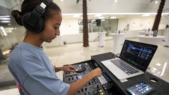 Saudi DJ Leen Naif plays at a university event in Saudia Arabia's Red Sea coastal city of Jeddah on May 26, 2022.(AFP)
