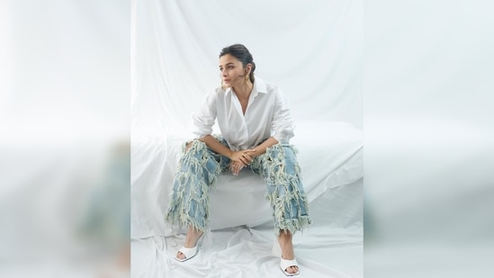 Alia Bhatt teamed her look with a pair of white square-toe pyramid heels and golden hoop earrings.(Instagram/@aliaabhatt)