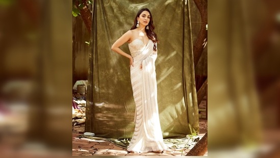 Kiara Advani wore this ivory sequin saree to one of the promotional events of her last release JugJugg Jeeyo. She added a contemporary touch to her look by pairing her saree with a strapless corset-inspired blouse.(Instagram/@kiaraaliaadvani)