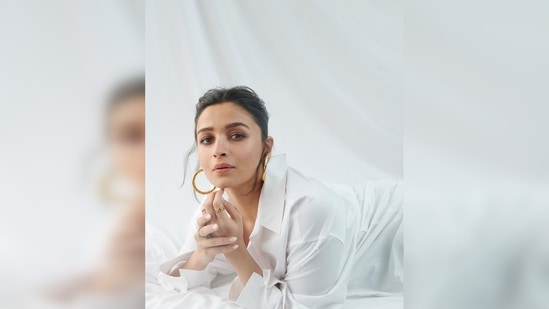 Alia Bhatt left her top shirt buttons unbuttoned for the street-style look. Her high-rise denim featured rip detailing all over.(Instagram/@aliaabhatt)