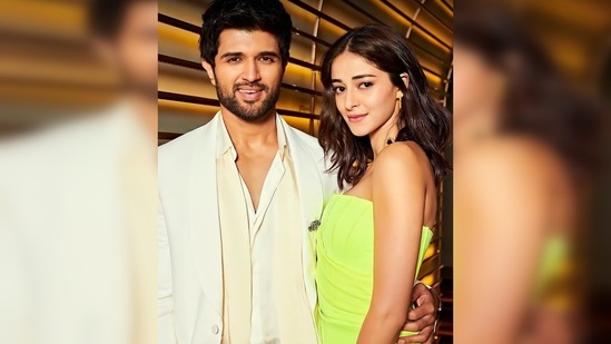 Ananya Panday donned a neon green strapless corset-inspired body-hugging dress while Vijay Devarakonda looked dapper in an all-white suit.(Instagram/@ananyapanday)