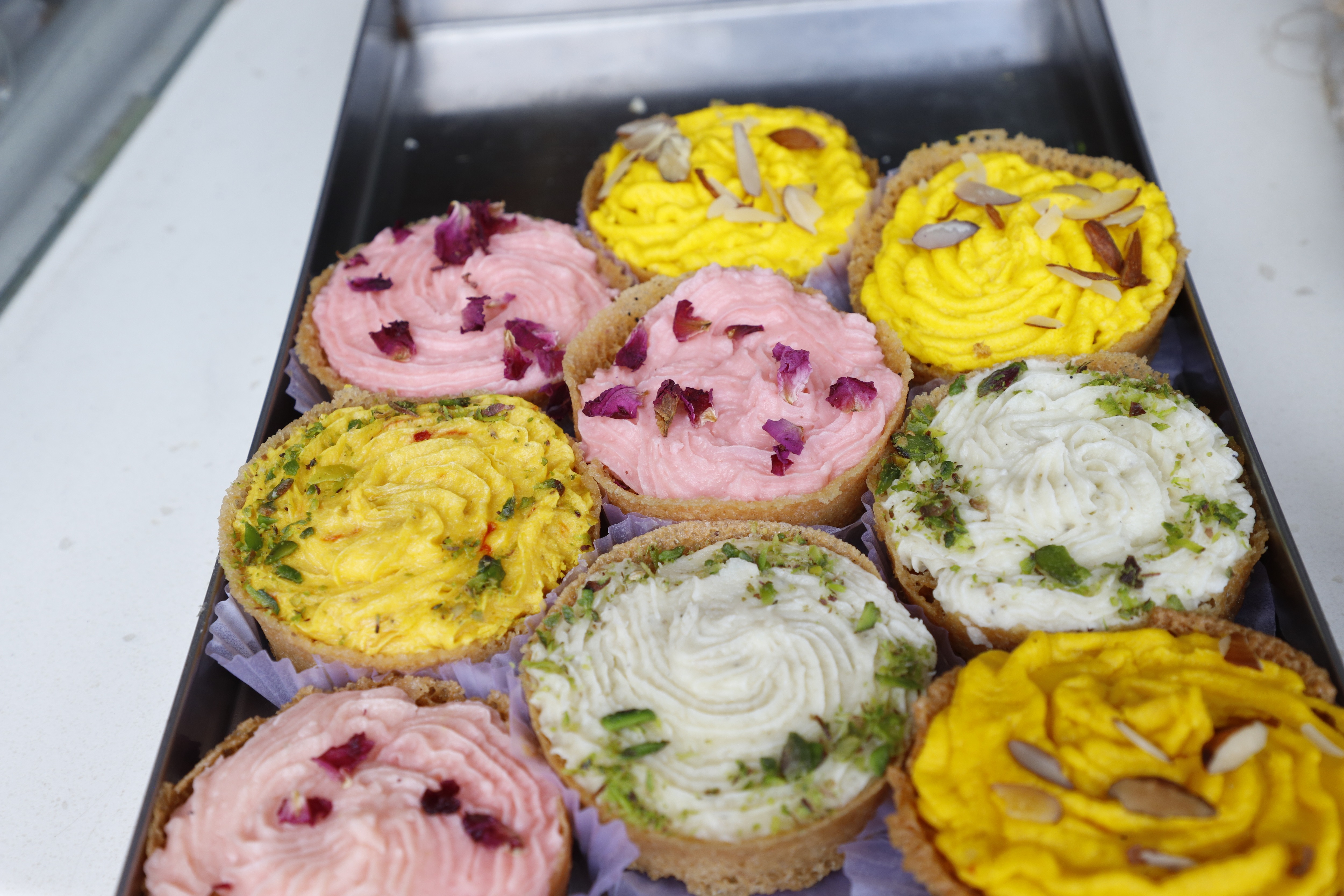 Take your pick from malai ghewar, kesar ghewar, chocolate ghewar or rose ghewar at Kanwarji Sweets, Chandni Chowk. (Photo: Shantanu Bhattacharya/HT) Take your pick from malai ghewar, kesar ghewar, chocolate ghewar or rose ghewar at Kanwarji Sweets, Chandni Chowk. (Photo: Shantanu Bhattacharya/HT)