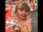 The little girl looks at a toy at the toy store for the first time in her life. (Instagram/@brittikitty) The little girl looks at a toy at the toy store for the first time in her life. (Instagram/@brittikitty)