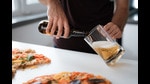 Hold your glass at a 45-degree angle from the beer while pouring it. (Shutterstock) Hold your glass at a 45-degree angle from the beer while pouring it. (Shutterstock)