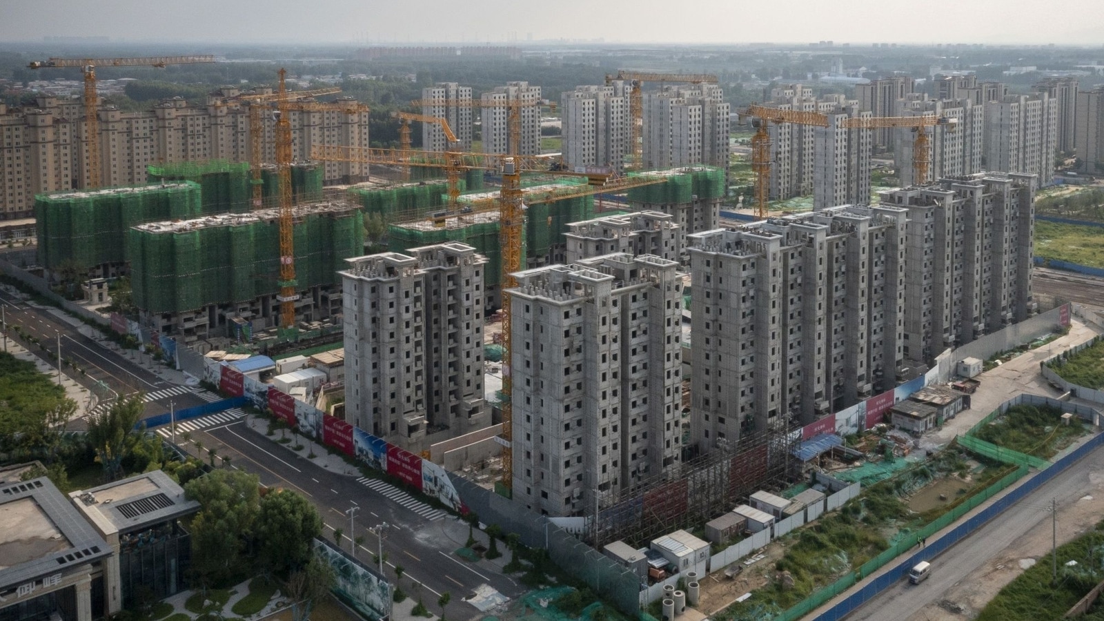 Chinese property giant Evergrande to pay $1.1 billion following indebtedness