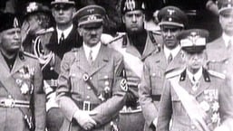 In a 1941 television file footage, King Victor Emanuel III, Adolf Hitler and Benito Mussolini watch fascist troops march in central Rome.  image via Reuters