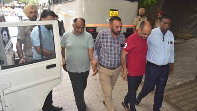 LIT employees being produced in court by the vigilance bureau in Ludhiana. (Gurpreet Singh/HT)