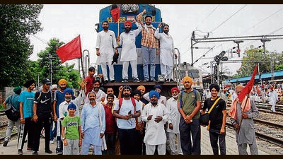 Farmers block a railway track in Amritsar on Sunday. (Sameer Sehgal /Hindustan Times) Farmers block a railway track in Amritsar on Sunday. (Sameer Sehgal /Hindustan Times)