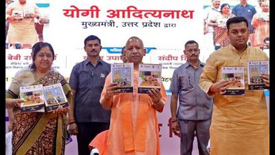 Uttar Pradesh CM Yogi Adityanath during the function at Lok bhavan in Lucknow on Monday. (ANI Photo)