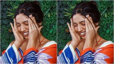 Bhumi added more drama to her look with a satin shirt featuring details in white and blue shades. (Instagram/@bhumipednekar)