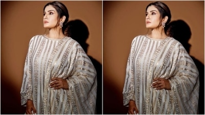 Raveena looked ravishing in a full-sleeved white and golden salwar. The salwar featured intricate details in golden embellishments. (Instagram/@officialraveenatandon)