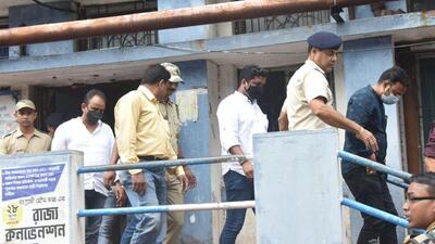 West Bengal police personnel with three Jharkhand Congress MLAs after a huge amount of cash was found in their vehicle on Saturday, in Howrah district. (PTI) West Bengal police personnel with three Jharkhand Congress MLAs after a huge amount of cash was found in their vehicle on Saturday, in Howrah district. (PTI)