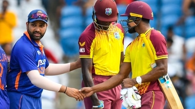 Rohit Sharma (L) of India is congratulated by Keemo Paul (R) of West Indies after winning the 1st T20i match between West Indies and India at Brian Lara Cricket Academy in Tarouba (AFP)