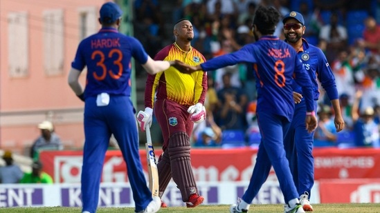 Ravindra Jadeja and Rohit Sharma celebrate the wicket of Shimron Hetmyer during the second T20I at Warner Park in Basseterre, Saint Kitts and Nevis(AFP)