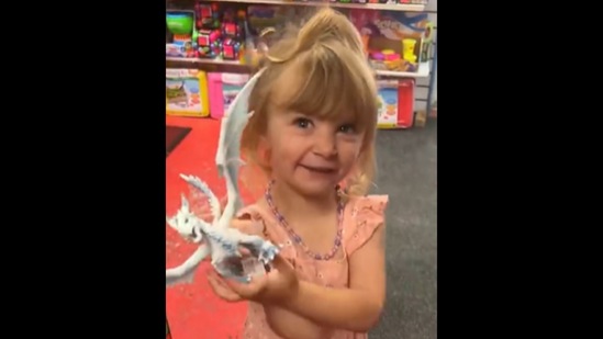 The little girl looks at a toy at the toy store for the first time in her life.&nbsp;(Instagram/@brittikitty)