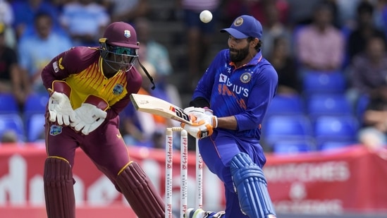 Ravindra Jadeja plays a shot under the watch of West Indies wicketkeeper Devon Thomas(AP)