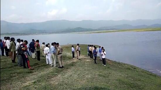 Police and people gather at the accident site in Bangana subdivision of Una on Monday. (HT Photo)