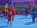 India's Mandeep Singh, centre, raises his arm as he celebrates after scoring a goal during pool B hockey match between India and England at the Commonwealth Games in Birmingham, England(AP)