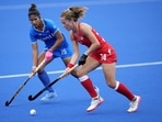 England's Shona McCallin, right, runs past India's Navneet Kaur after taking control of the ball during the Women's Pool A hockey match between England and India at the Commonwealth Games in Birmingham, England,(AP)