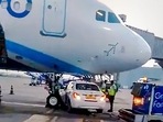A car belonging to Go First airline stops under an IndiGo A320neo aircraft, narrowly avoiding collision with the plane's nose wheel, at the T2 terminal of IGI Airport in New Delhi on Tuesday,(PTI) A car belonging to Go First airline stops under an IndiGo A320neo aircraft, narrowly avoiding collision with the plane's nose wheel, at the T2 terminal of IGI Airport in New Delhi on Tuesday,(PTI)
