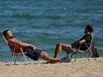 Tourists sunbathe on a beach in Fuengirola, near Malaga, Spain&nbsp;