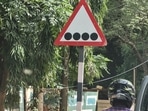 Traffic sign with four black dots on a white surface. Traffic sign with four black dots on a white surface. 