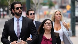 The son, left, and daughter, back right, of Pittsburgh dentist Lawrence "Larry" Rudolph. (File Photo)