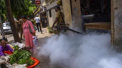 A BMC worker fumigates at Byculla on Tuesday Satish Bate/HT Photo A BMC worker fumigates at Byculla on Tuesday Satish Bate/HT Photo
