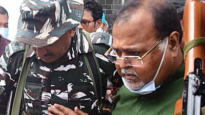 The woman threw her sandal at Partha Chatterjee when he was taken by central paramilitary force personnel to a hospital for a routine check up. (ANIl) The woman threw her sandal at Partha Chatterjee when he was taken by central paramilitary force personnel to a hospital for a routine check up. (ANIl)