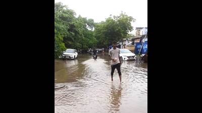 Commuters struggling on water logged roads of Prayagraj on Tuesday. (HT) Commuters struggling on water logged roads of Prayagraj on Tuesday. (HT)