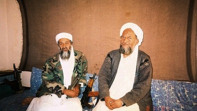 Osama bin Laden sits with his adviser Ayman al-Zawahiri, an Egyptian linked to the al Qaeda network. (via REUTERS)